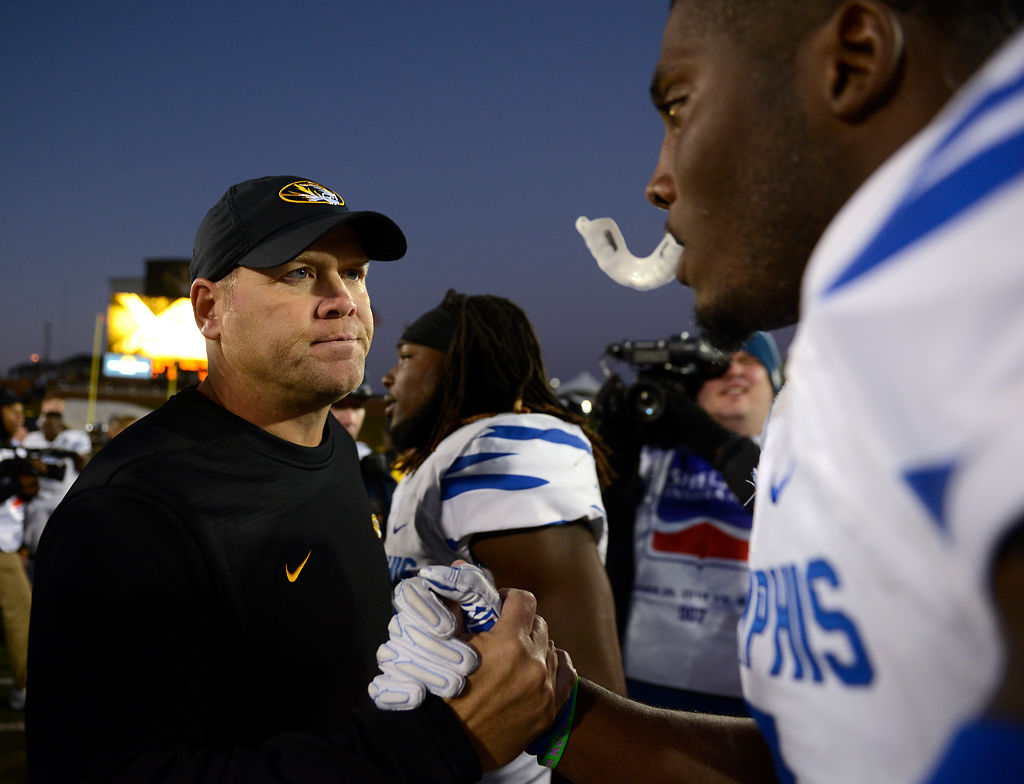 Barry Odom talks with Memphis players on Oct. 20